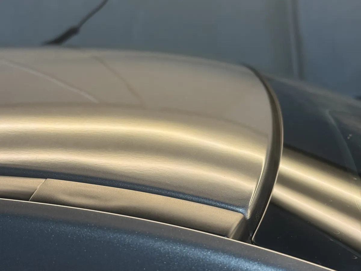 The same roof after paintless dent repair, dent removed